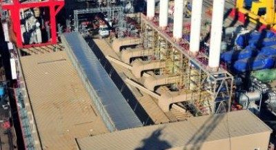 Dönüşüm sırasında: ambarların üzerinde bacalar yükseliyor